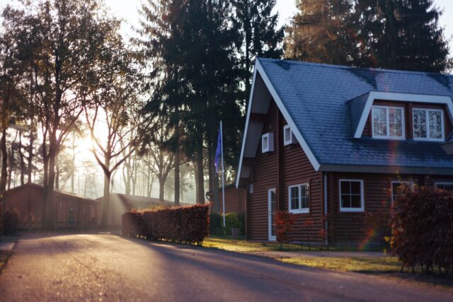 Photo by Rowan Heuvel brown and red house near trees