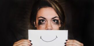 person holding white printer paper