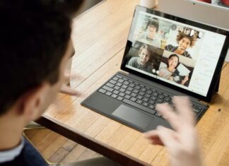 Can We Imagine the Future of Remote Working Without Video Conferencing? person in blue long sleeve shirt using black Surface