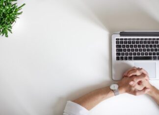 5 Ways Businesses Can Engage With Their Customers Online person wearing watch near laptop