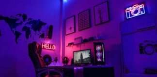 black flat screen tv turned on near white wall