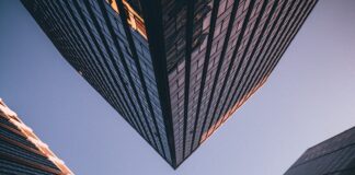 low-angle photography of four high-rise buildings