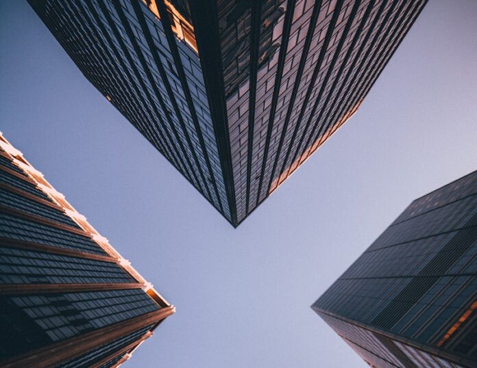 Photo by Kevin Matos low-angle photography of four high-rise buildings