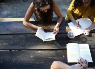 Top 6 Memorization Strategies for Students to Succeed in School woman reading book while sitting on chair