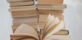 white book on brown wooden table