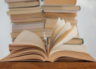 white book on brown wooden table