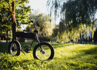 What You Need to Know About Fat Tire Electric Folding Bikes for Adult black and gray motorcycle on green grass field during daytime