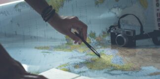 person writing on white paper