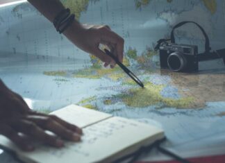 person writing on white paper