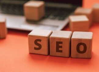 The Benefits of SEO vs PPC Letters on the Wooden Blocks