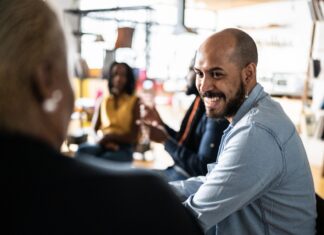 A picture containing person, indoor, crowd Description automatically generated