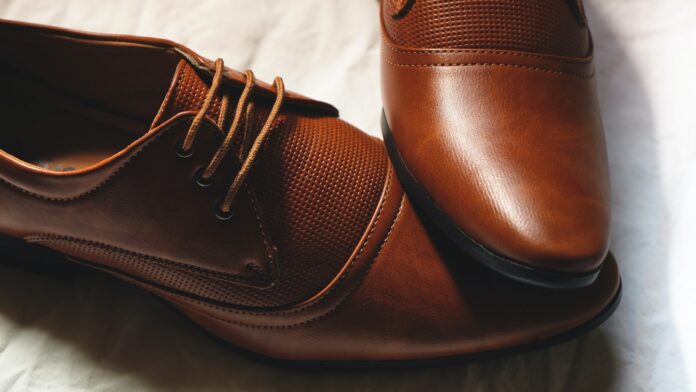 Photo by Ayrus Hill brown leather lace up shoes