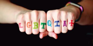 person with blue and red manicure