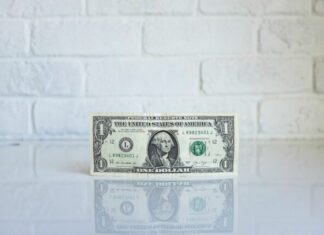 4 Benefits of Pay Transparency 1 U.S. dollar banknote on white surface