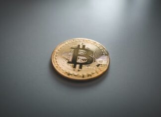 Complications in Making Money from Bitcoins gold round coin on gray surface