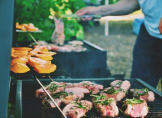 5 Outdoor Cooking Options for When You Have Company person grilling meat