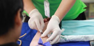 Free Person Getting His Blood Check Stock Photo