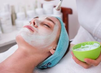 Skincare Tips for Every Skin Type: Keeping Your Skin Healthy and Radiant woman lying on blue towel with white cream on face