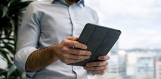 person holding black smart cover during daytime