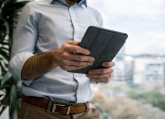 person holding black smart cover during daytime