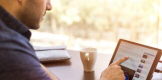 man holding tablet computer