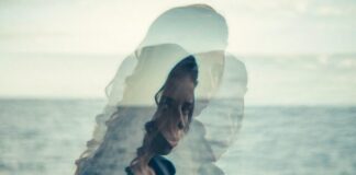 woman standing near body of water