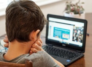 The Benefits of Online Learning: Pros and Cons boy in gray shirt using black laptop computer