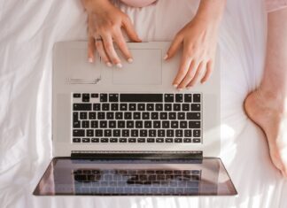 Enhancing Trust in Online Gambling through Blockchain and Cryptography woman using MacBook Pro