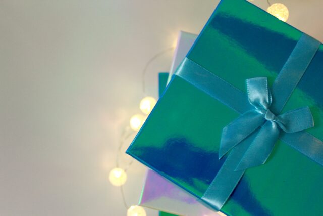 Photo by Bridget Mac Donald green gift box with white ribbon