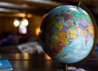 An Introduction to ESG Investment and How to Do It Well desk globe on table