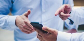 person holding black smartphone
