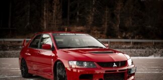 red chevrolet camaro on road during daytime
