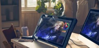 black and silver laptop computer on brown wooden table