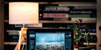 MacBook Pro on brown wooden table inside room
