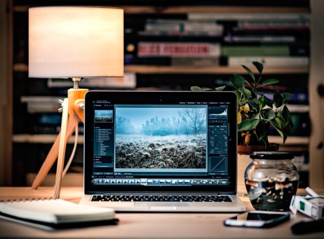 Photo by Radek Grzybowski MacBook Pro on brown wooden table inside room