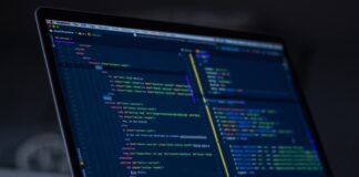 turned-on MacBook Pro wit programming codes display