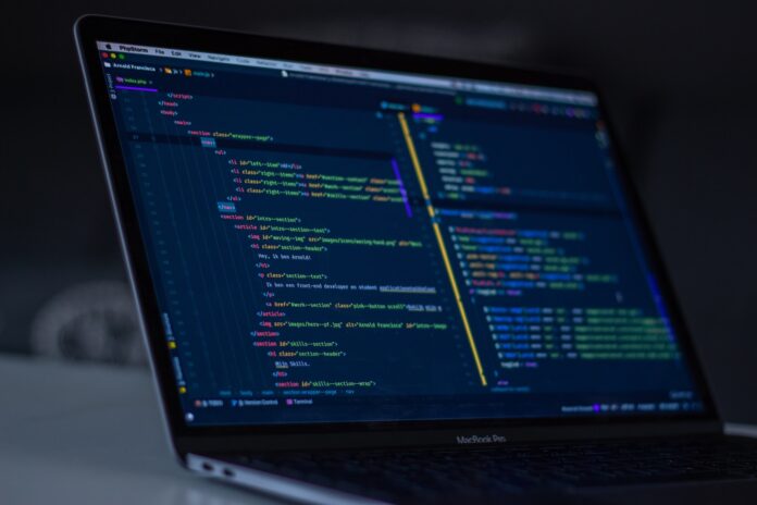Photo by Arnold Francisca turned-on MacBook Pro wit programming codes display