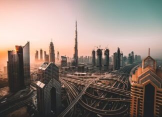 Purchase of Real Estate in Dubai – How to Adapt in a New Country? aerial photo of city highway surrounded by high-rise buildings