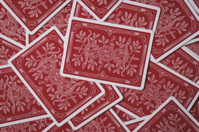 Photo by José Pablo Iglesias red playing cards