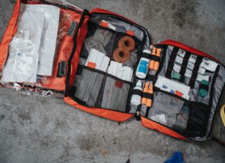 The Ultimate Traveler’s Medicine Kit: Stay Prepared On Your Adventures With Better Health orange white and black bag