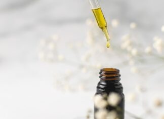 Relieving From Pain: Can CBD Help Manage Chronic Pain? clear glass bottle with yellow lid