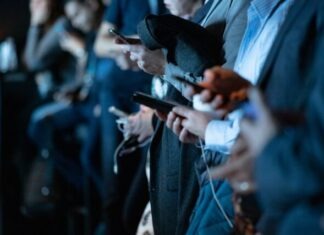 The Impact of Social Media on Harlem Politics people using phone while standing