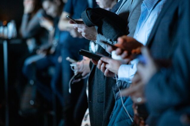 Photo by camilo jimenez people using phone while standing