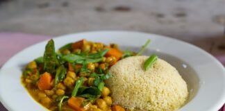 rice with green leaf vegetable on white ceramic plate