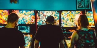 people playing arcade machines