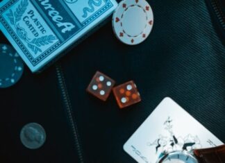 The Future of Gambling: How Online Casinos Are Transforming the Economy two orange dice on black surface