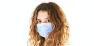 woman in white tank top with white face mask