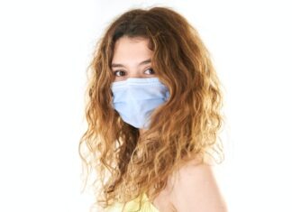 Get to Understand Non-Surgical Hair Replacement System! woman in white tank top with white face mask