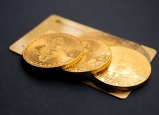 Bitcoin: The Pioneer of Cryptocurrencies three round gold-colored Bitcoin tokens