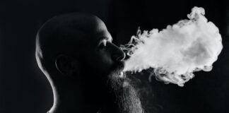 man smoking with black background